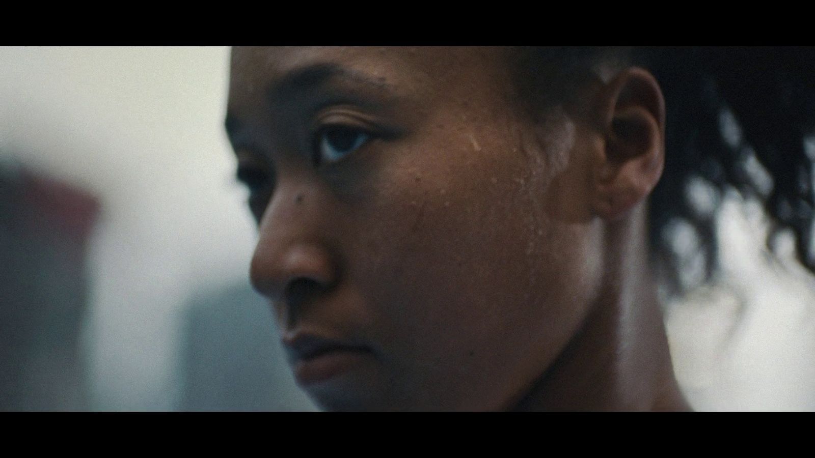 a close up of a woman's face with tears