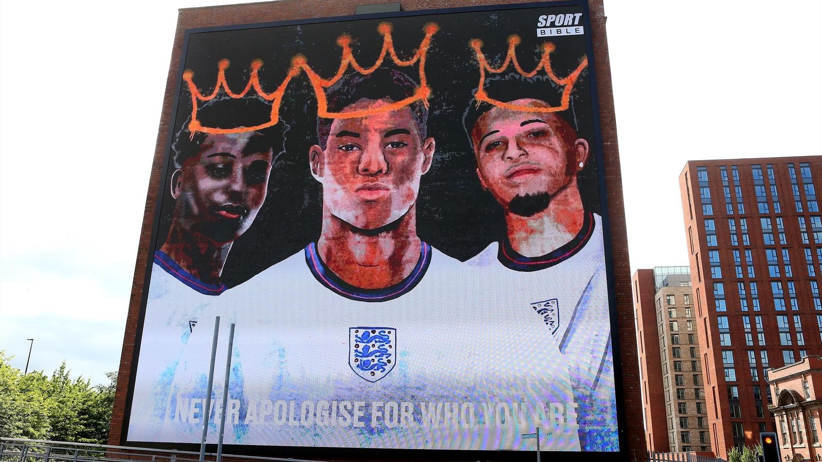 a large poster of two men with crowns on their heads