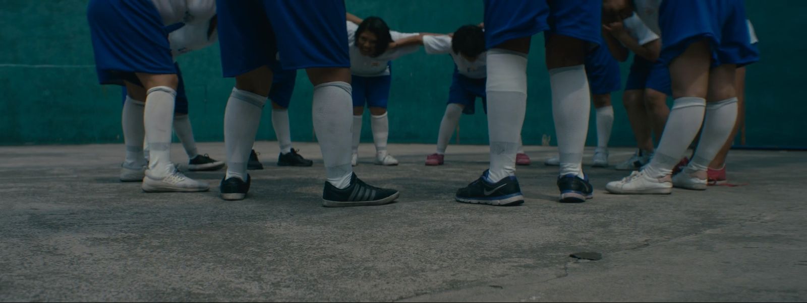 a group of soccer players standing next to each other