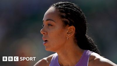 a close up of a tennis player wearing a purple top