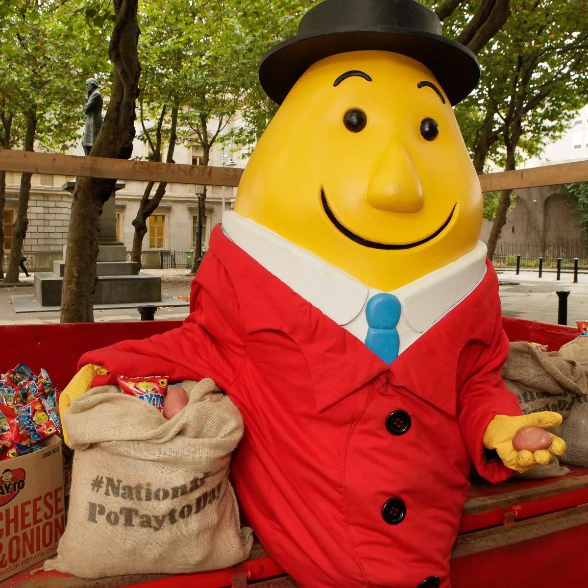 a large statue of a man in a suit and tie