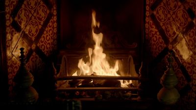 a fire burning in a fireplace in a room