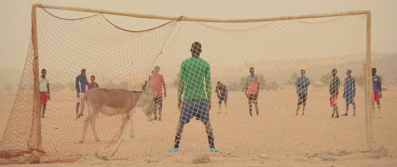 a group of young men playing a game of soccer