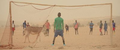 a group of young men playing a game of soccer