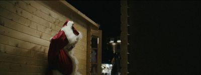 a santa hat hanging on the side of a building