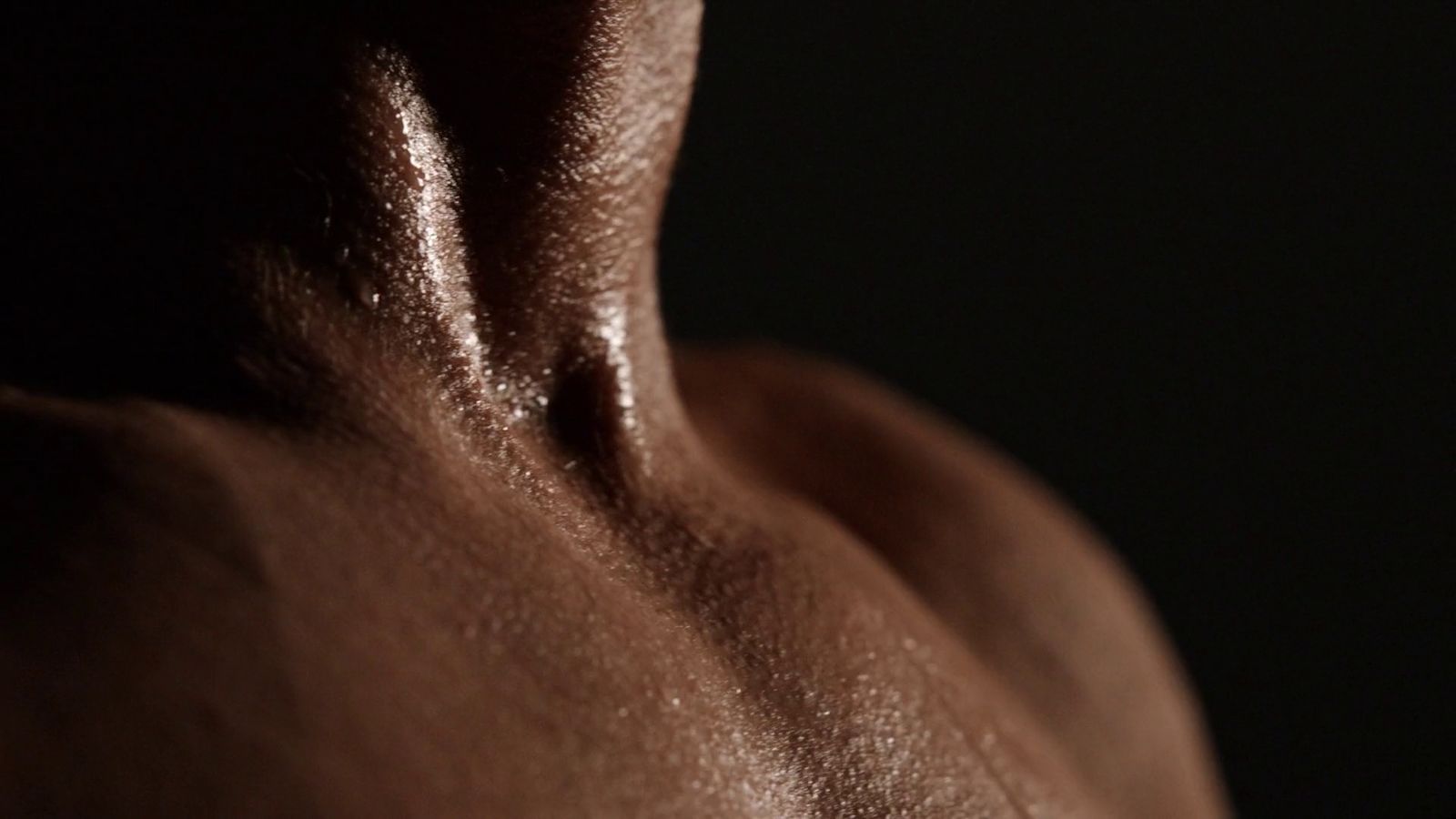 a close up of a man's back with no shirt on