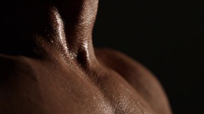 a close up of a man's back with no shirt on