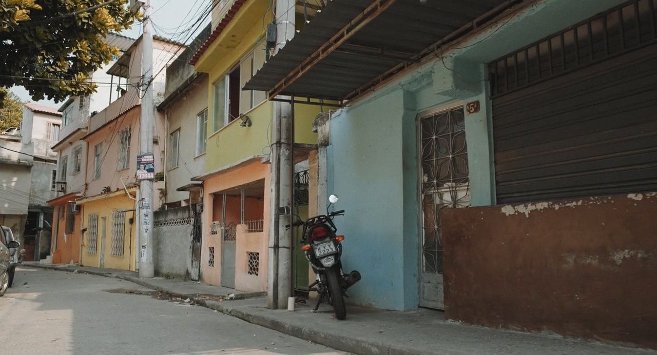 a motor scooter parked on the side of a street