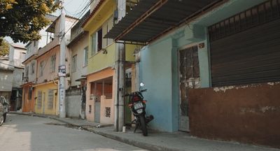 a motor scooter parked on the side of a street