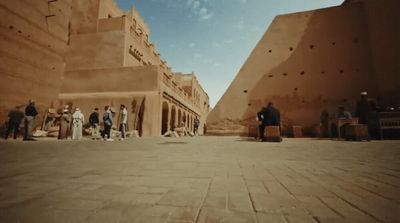 a group of people standing in front of a building