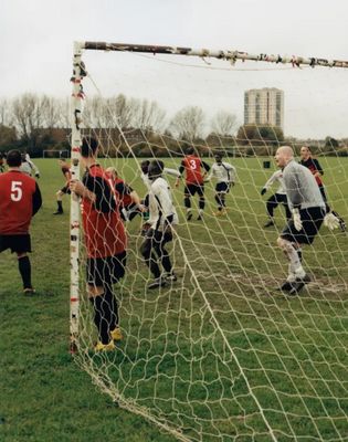 a group of men playing a game of soccer