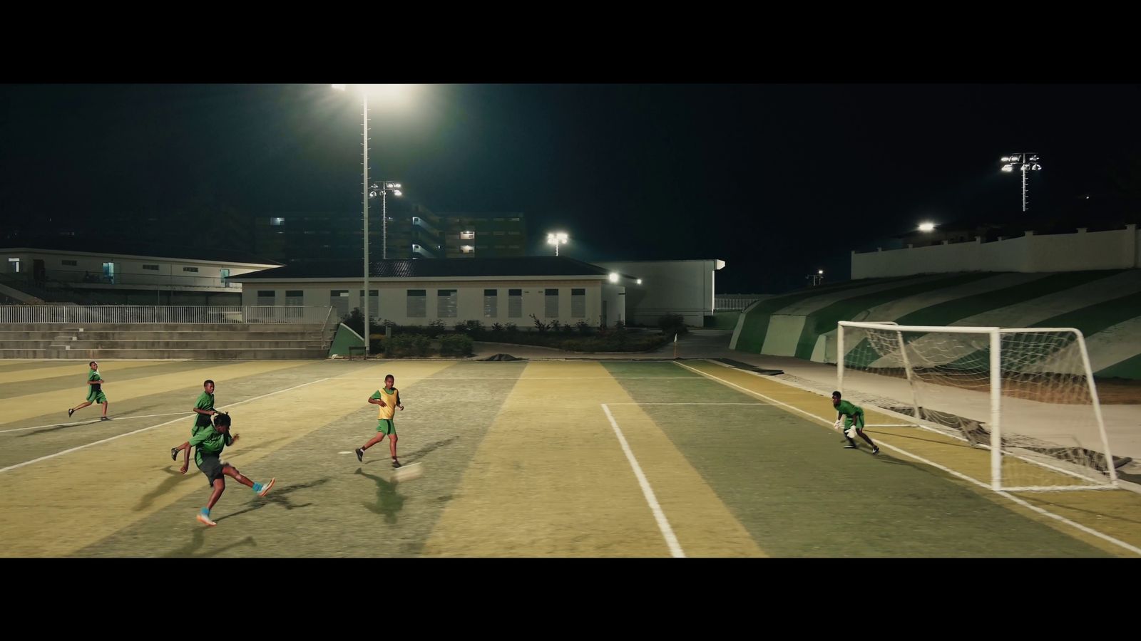 a group of young people playing a game of soccer