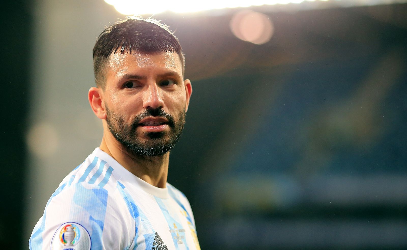 a close up of a soccer player with a beard