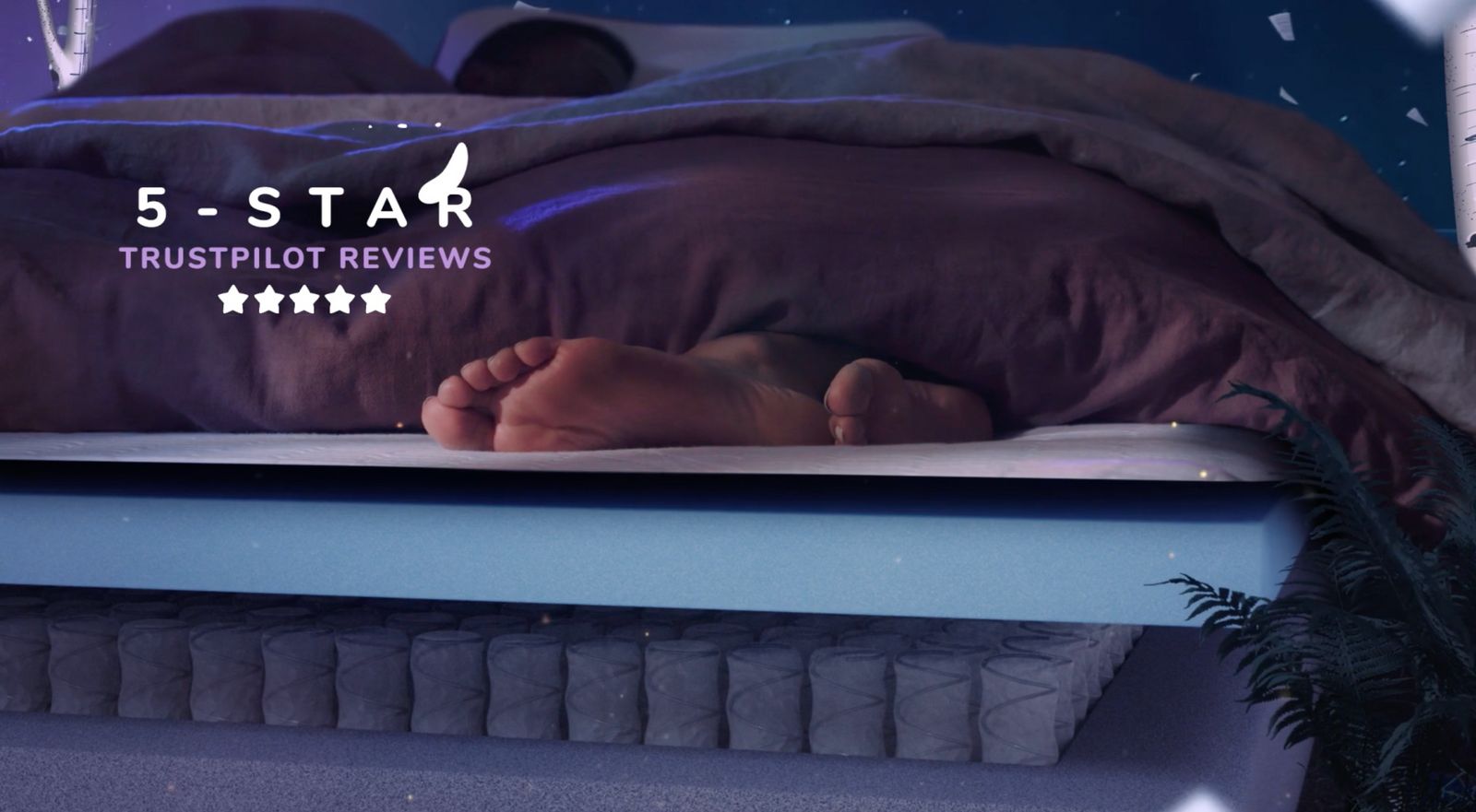 a bed with a purple comforter and five star logo