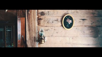 a wooden wall with a picture hanging on it