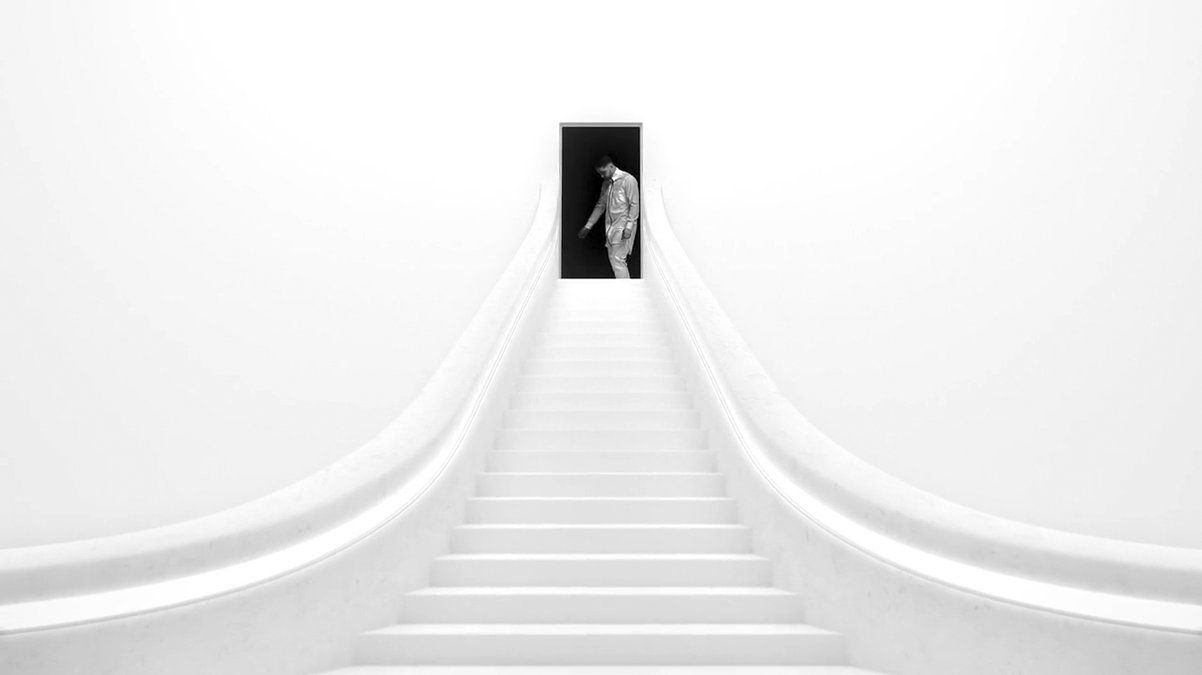 a man is walking up a set of stairs