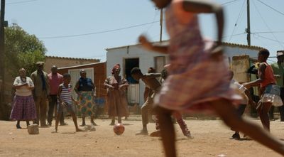 a group of people playing a game of soccer