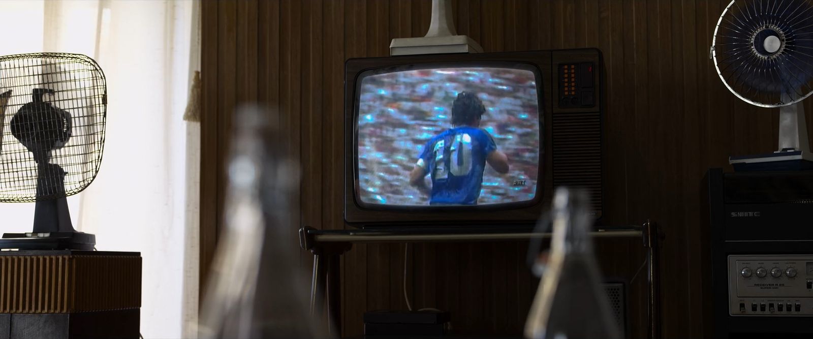 a television sitting on top of a wooden table