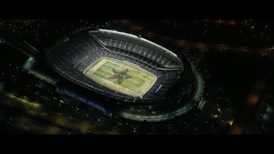 an aerial view of a football stadium at night