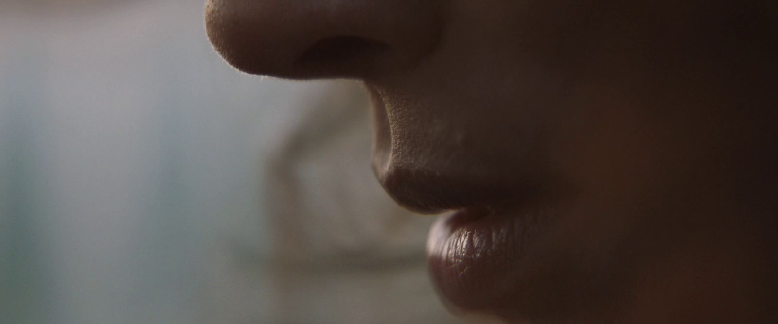 a close up of a person's nose with a blurry background