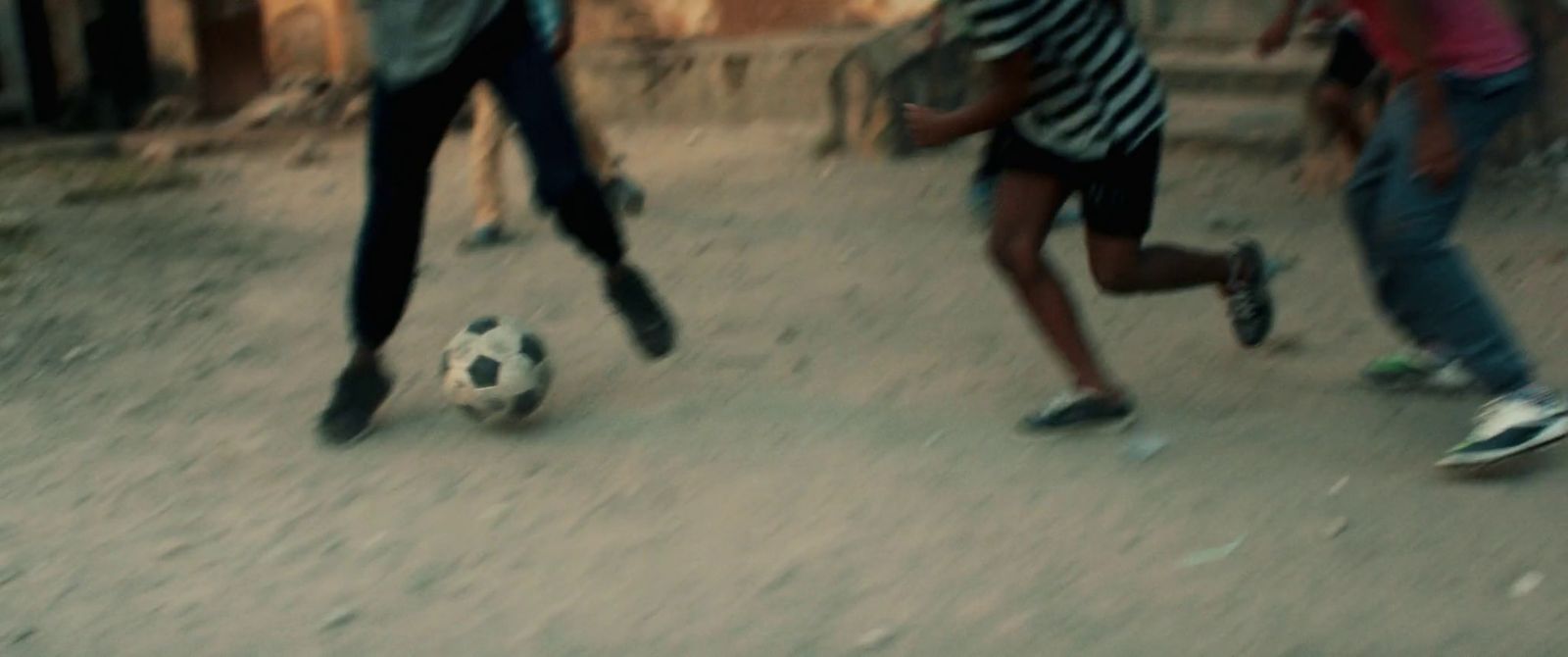 a group of young people playing a game of soccer