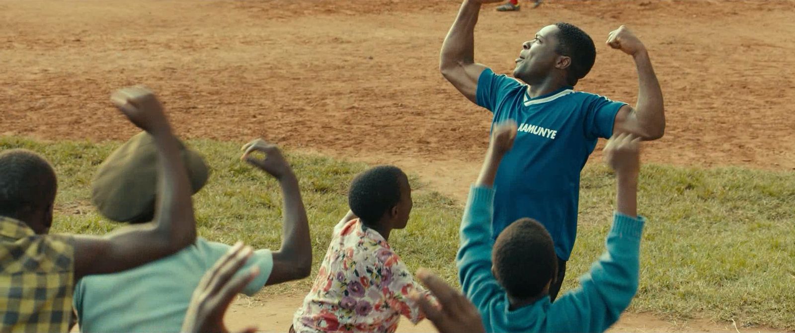 a group of young men playing a game of frisbee