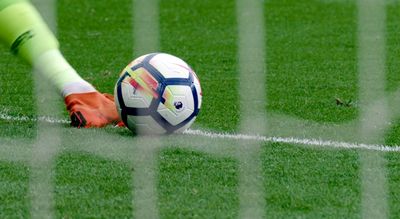 a soccer ball sitting on top of a soccer field