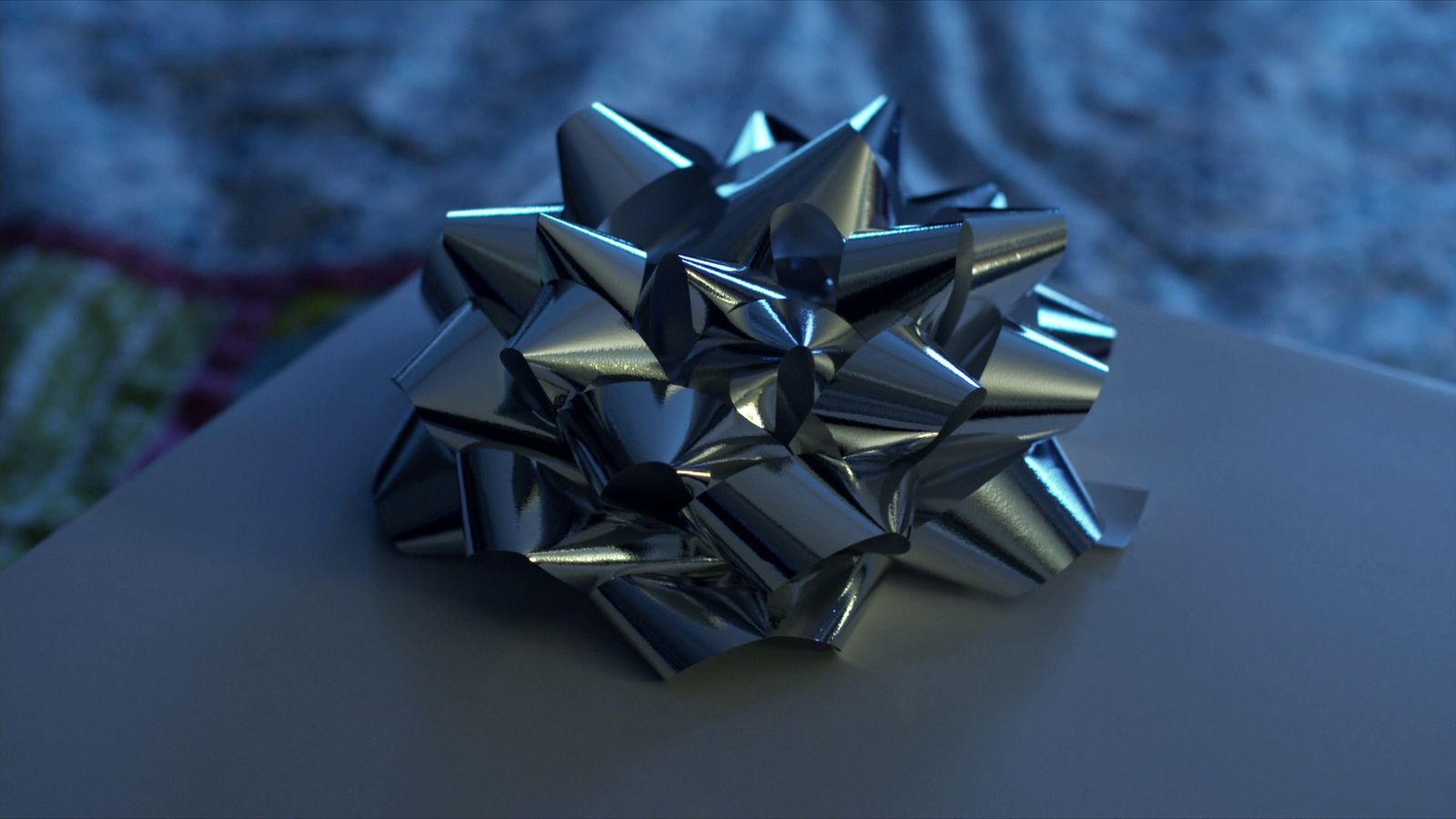 a silver bow sitting on top of a table