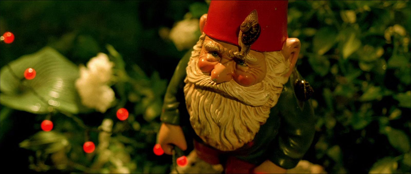 a close up of a gnome figurine in a garden