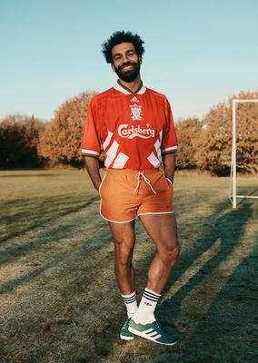 a man standing in front of a soccer ball