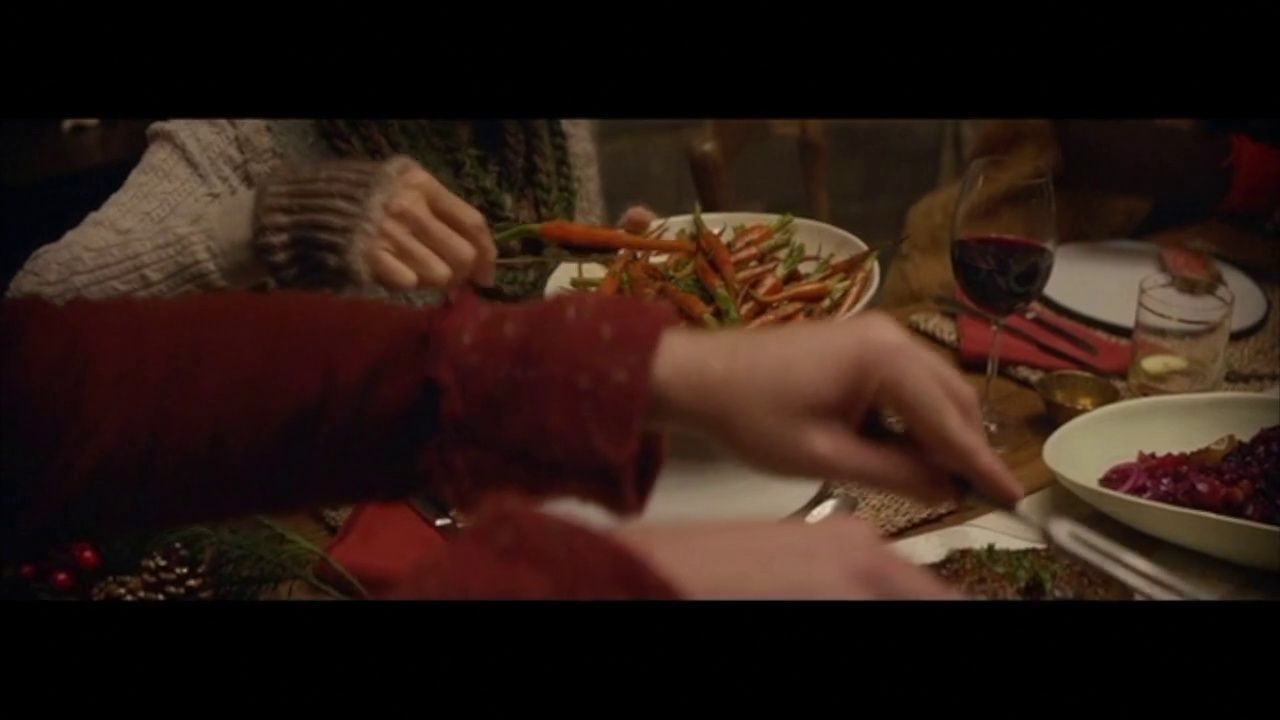 two people are serving themselves a plate of food