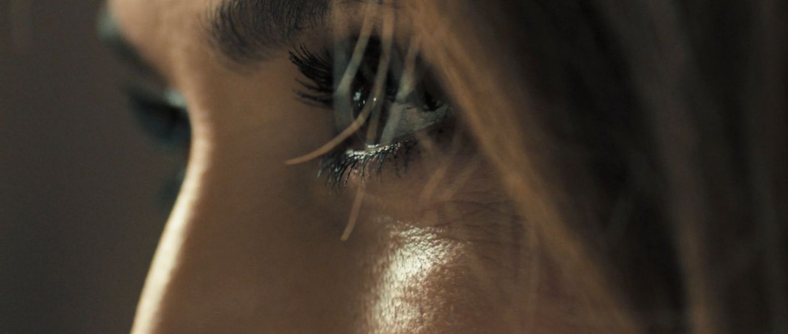 a close up of a woman's eye with long lashes