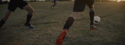 a group of people playing a game of soccer