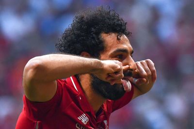 a close up of a soccer player with a beard