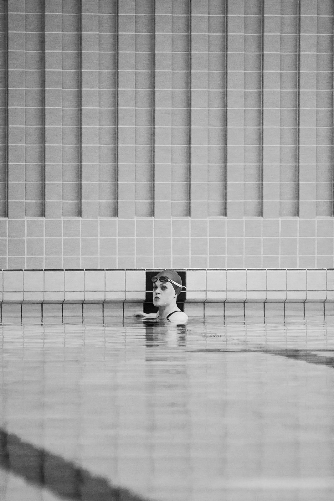 a woman swimming in a pool of water