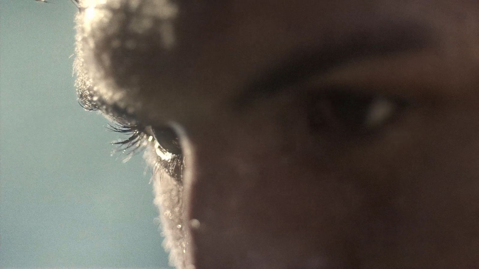 a close up of a person's eye with a blurry background