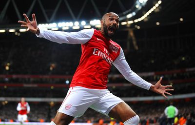 a man in a red and white uniform is celebrating a goal