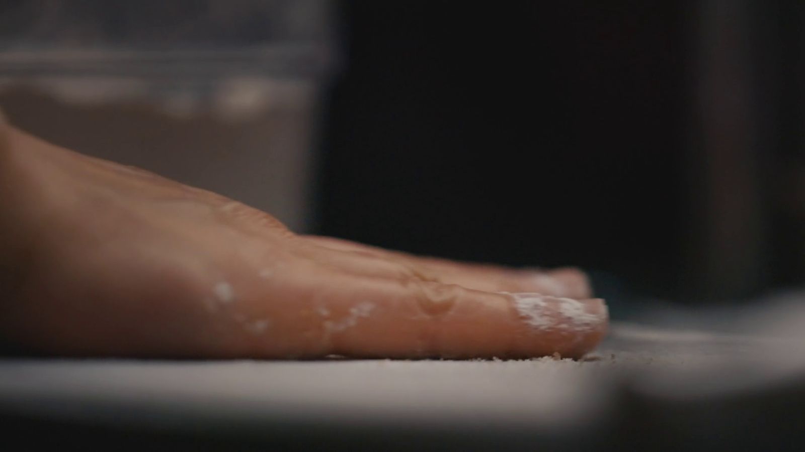 a close up of a person's bare foot on the floor