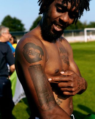 a man with a tattoo on his arm