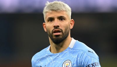 a close up of a soccer player wearing a blue uniform