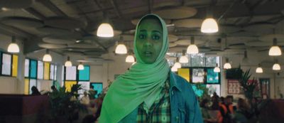 a woman with a green scarf around her neck