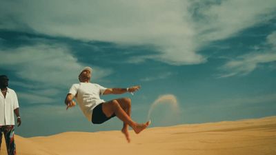 a man jumping in the air with a frisbee in his hand