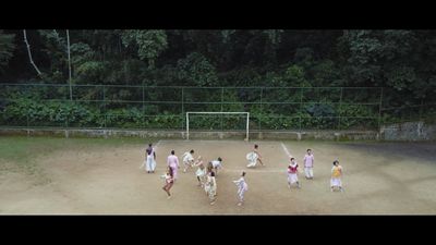 a group of people playing a game of soccer