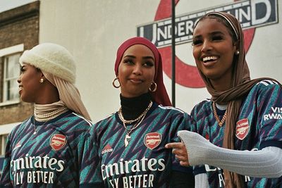 a group of women standing next to each other