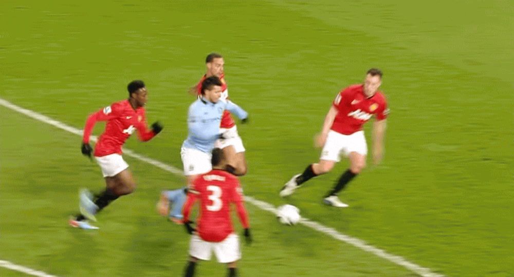 a group of men on a field playing soccer