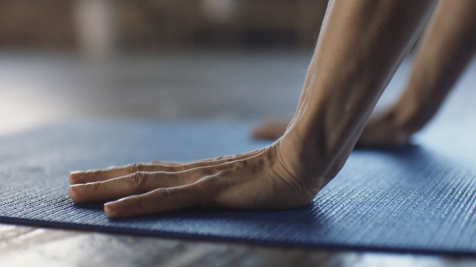 a close up of a person's bare feet on a yoga mat