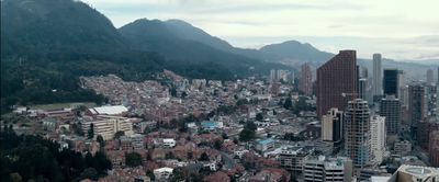 a view of a city with mountains in the background