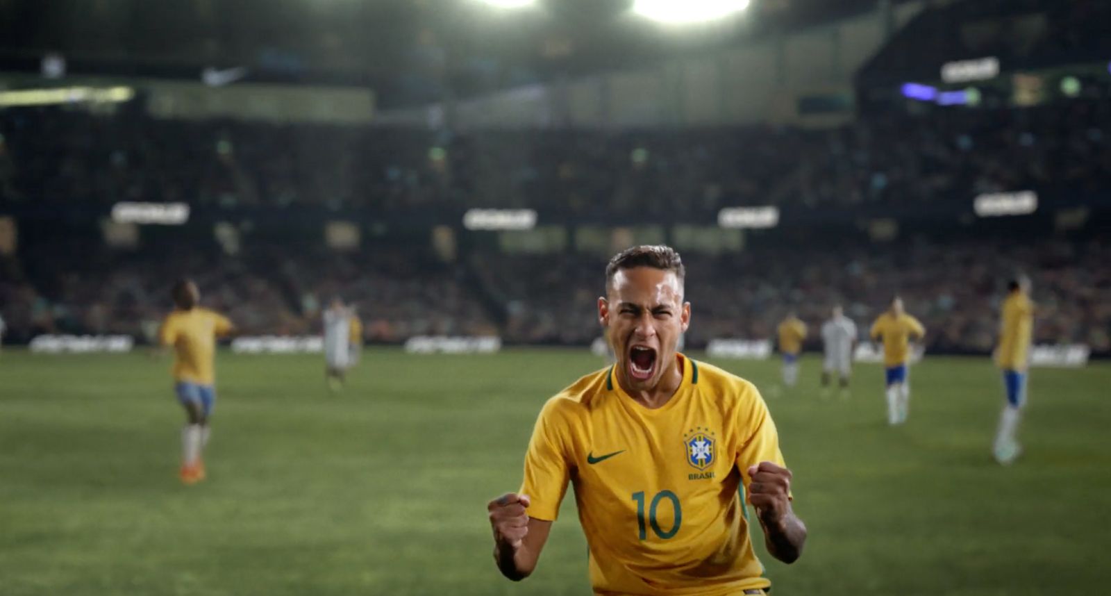 a soccer player celebrates a goal in front of a crowd