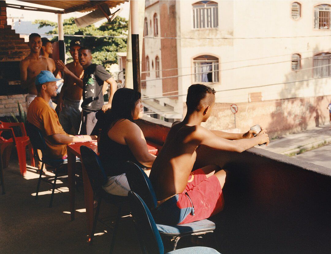 a group of people sitting on top of a roof