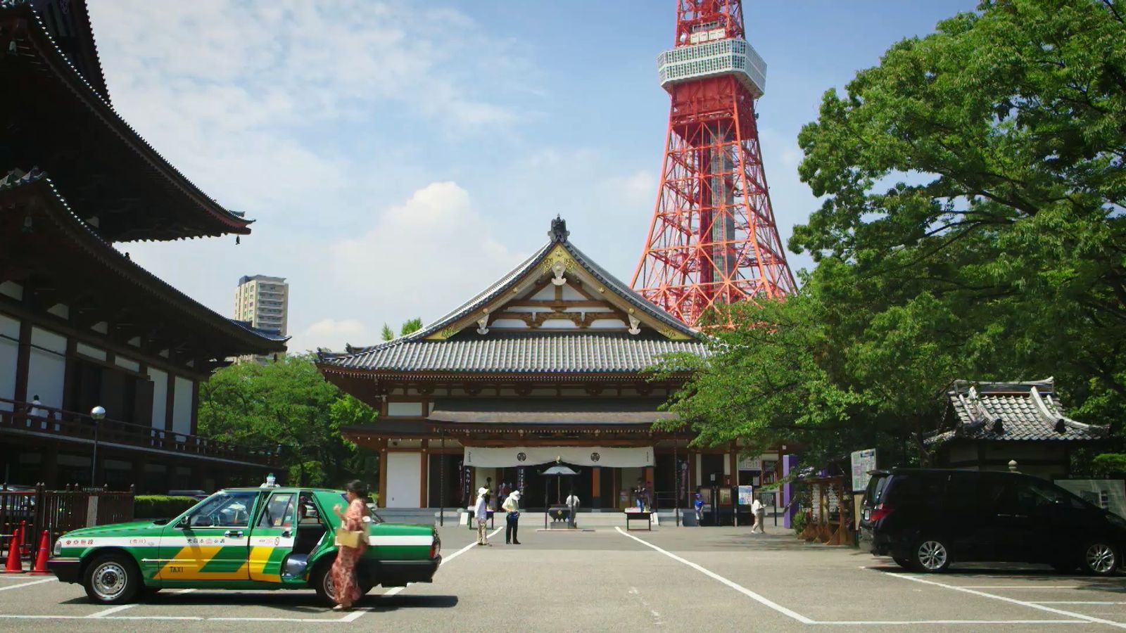 a car parked in front of a tall tower